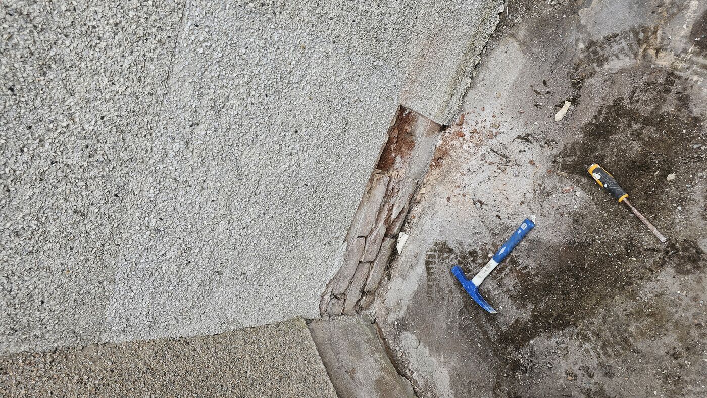 Bossed roughcast — delaminated section hacked off