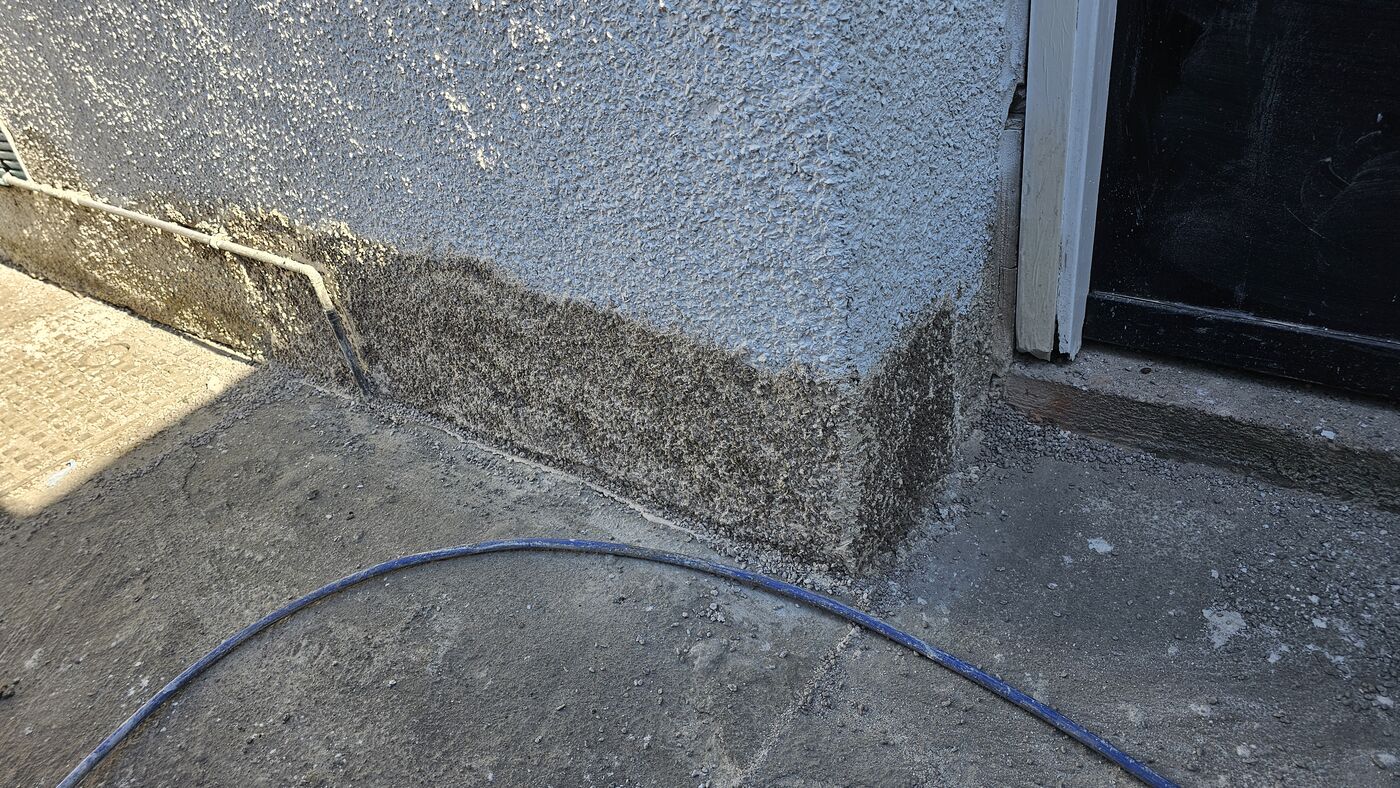 Aggregate coat over repaired roughcast section
